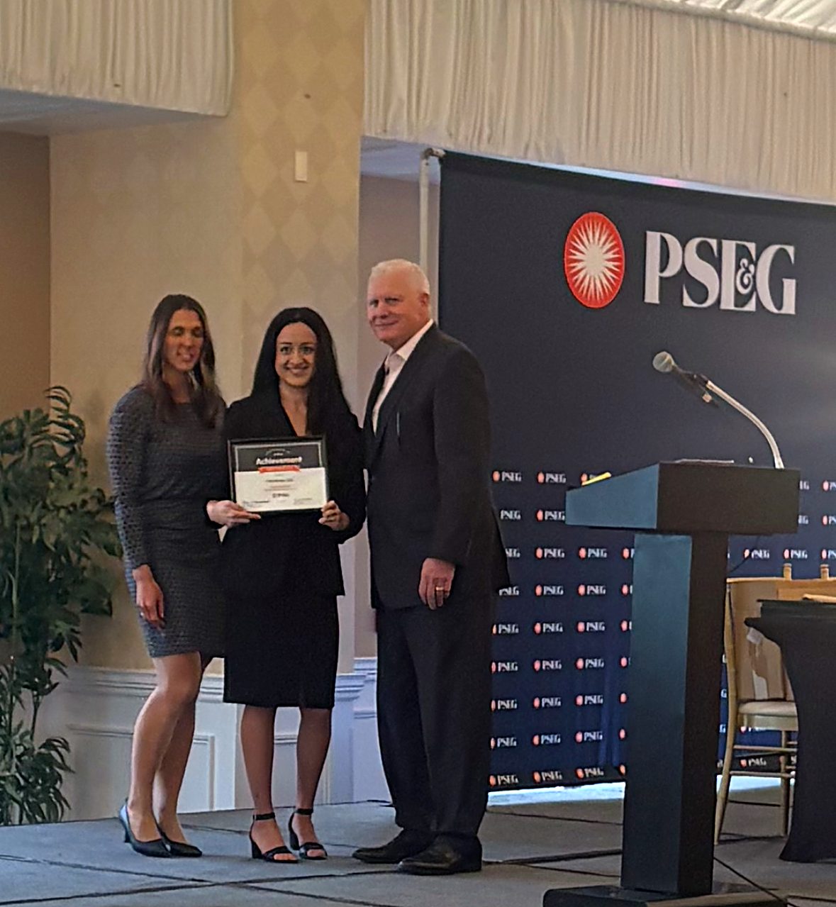 Krystal Soto-Perez accepts the 2025 PSE&G Top 10 Contractor award on behalf of Ciel Power LLC at the DoubleTree by Hilton in Cherry Hill Township, NJ